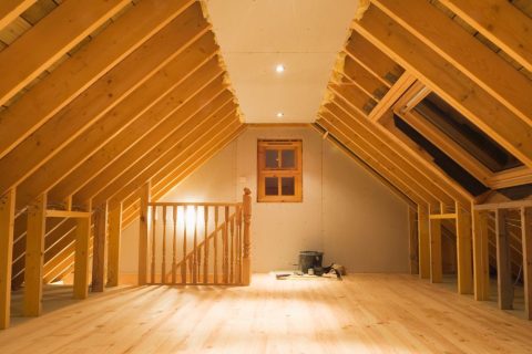 Newly built attic with bare timber beams and floor